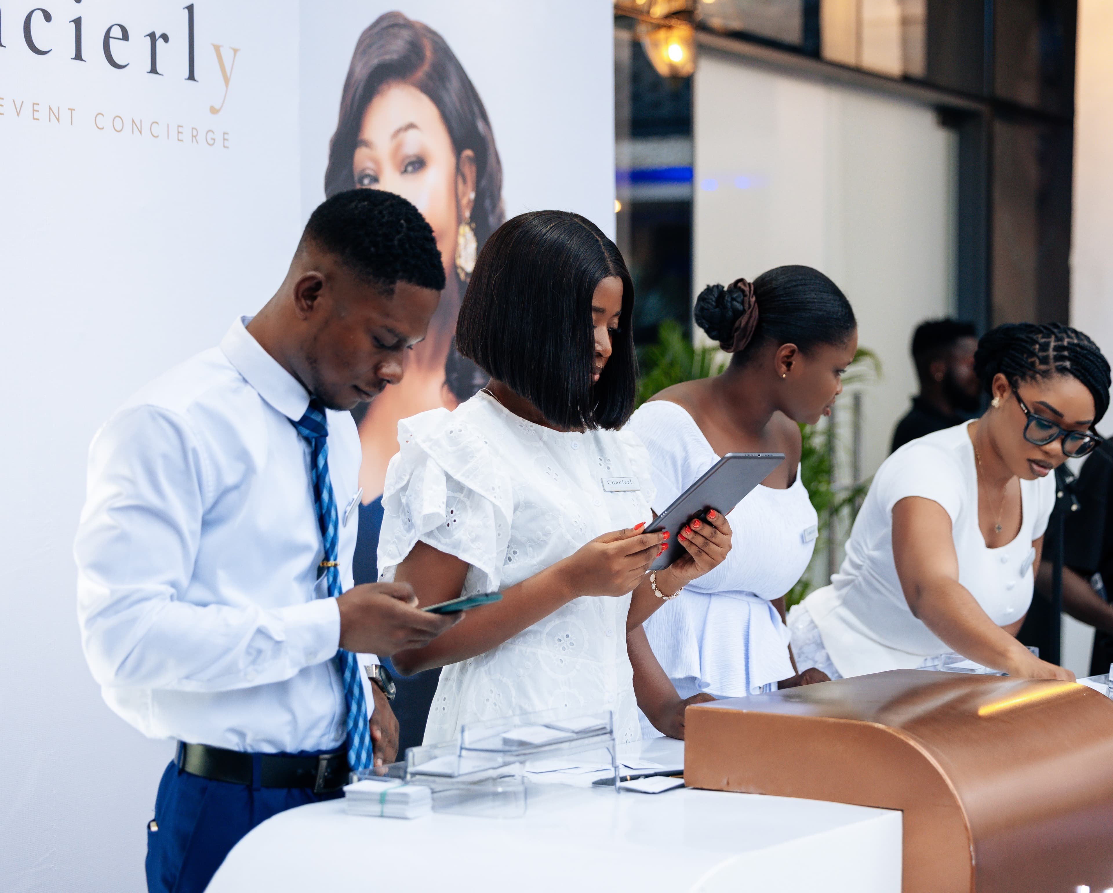 Concierly branded entrance and check-in booth at a premium event