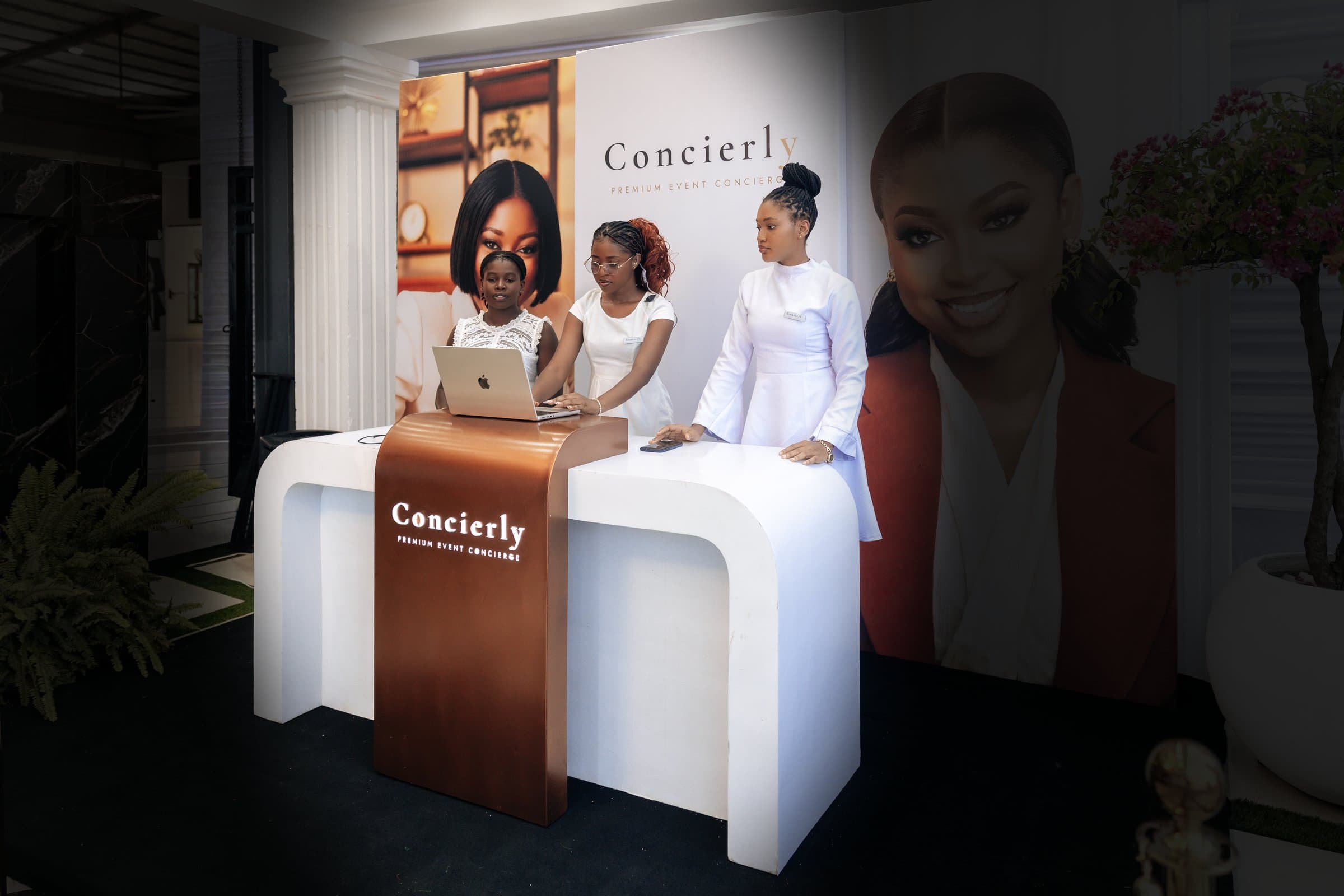 Concierly branded entrance and check-in booth at a premium event